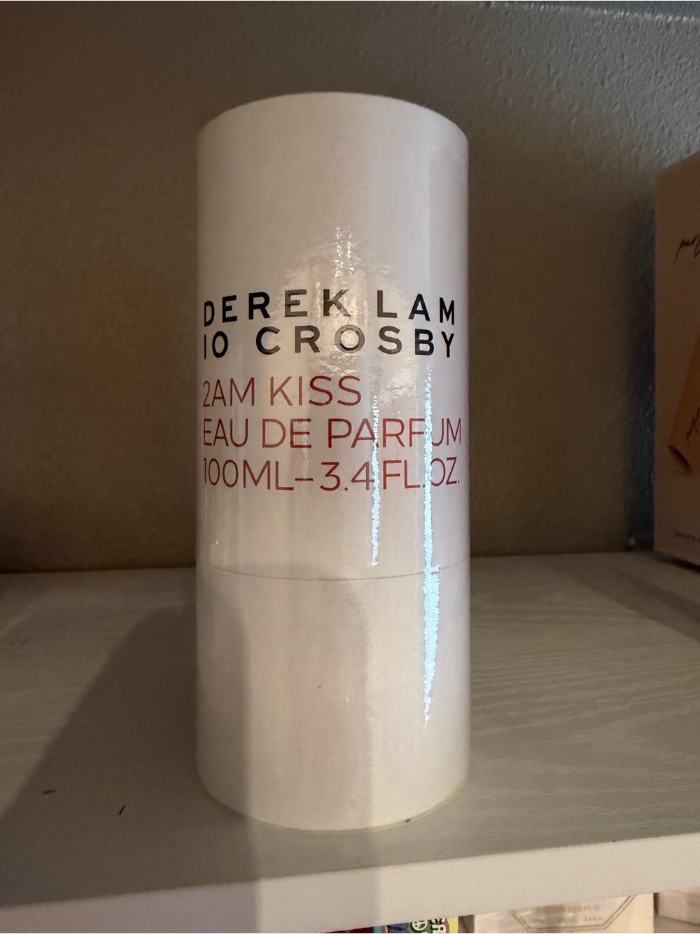 Derek Lam White Cylinder with Black and Red Lettering